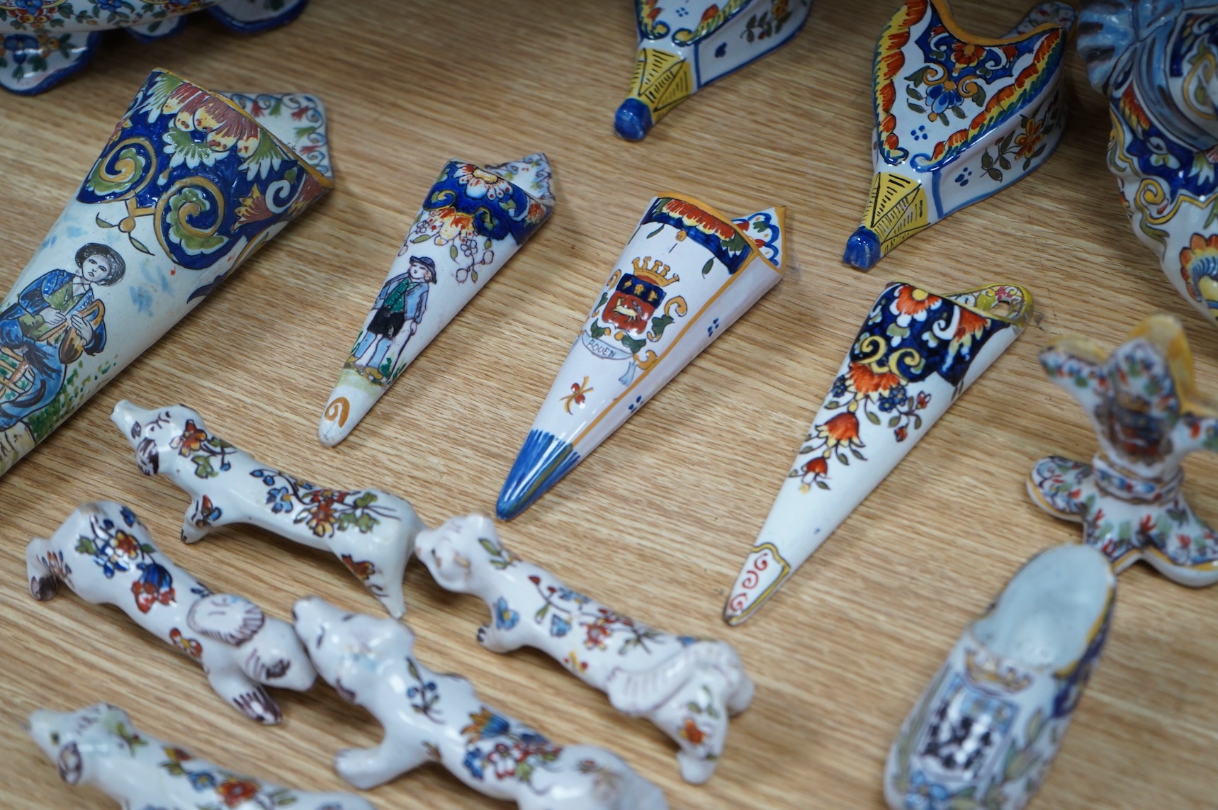 19th century French decorative faience including bag pipes, a large wall pocket, jardiniere etc (22).